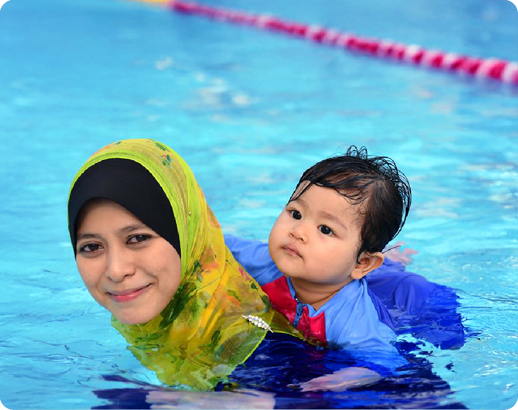 Adult learning to swim in pool